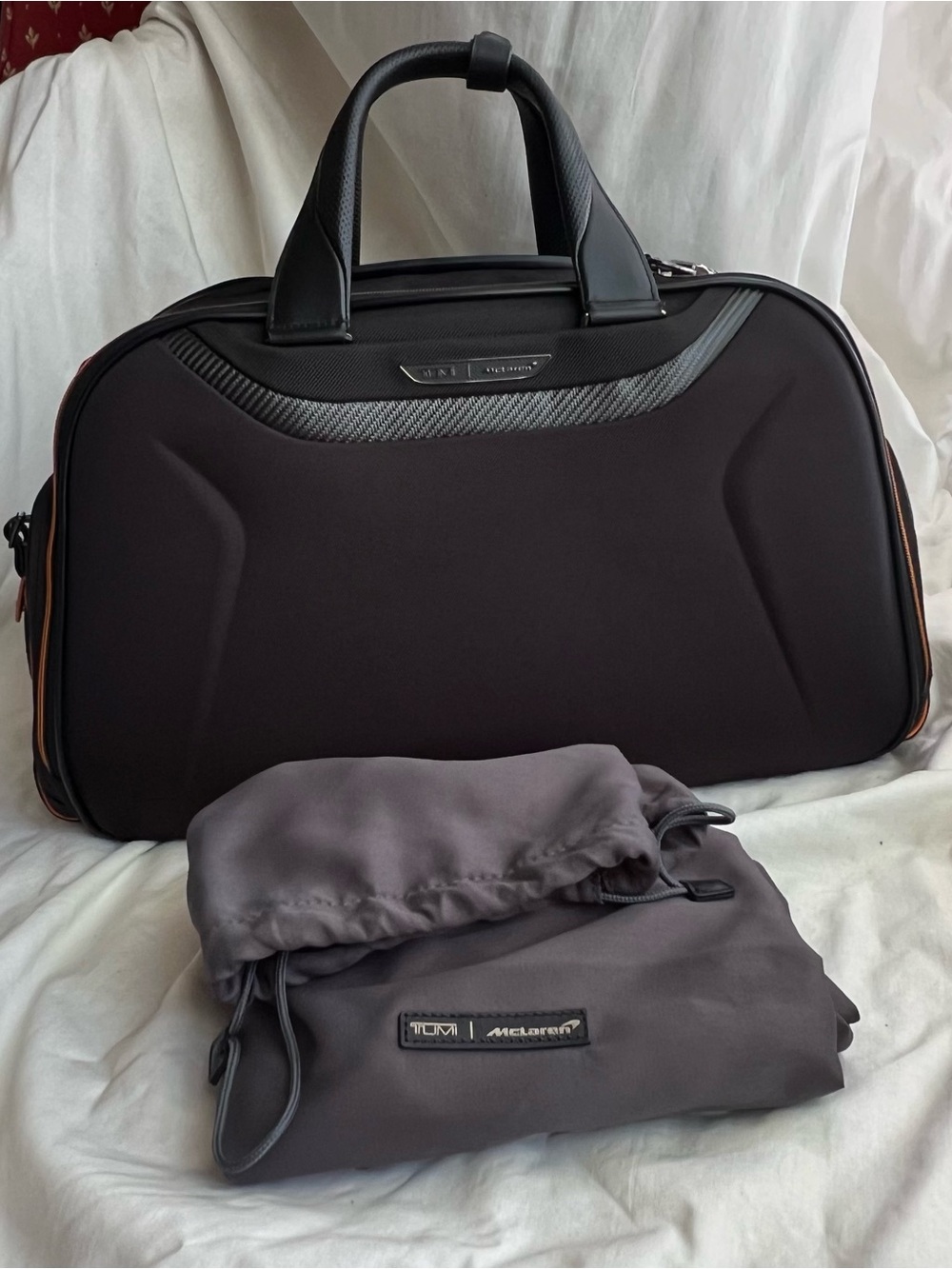 TUMI McLaren Duffel black color with orange stitching